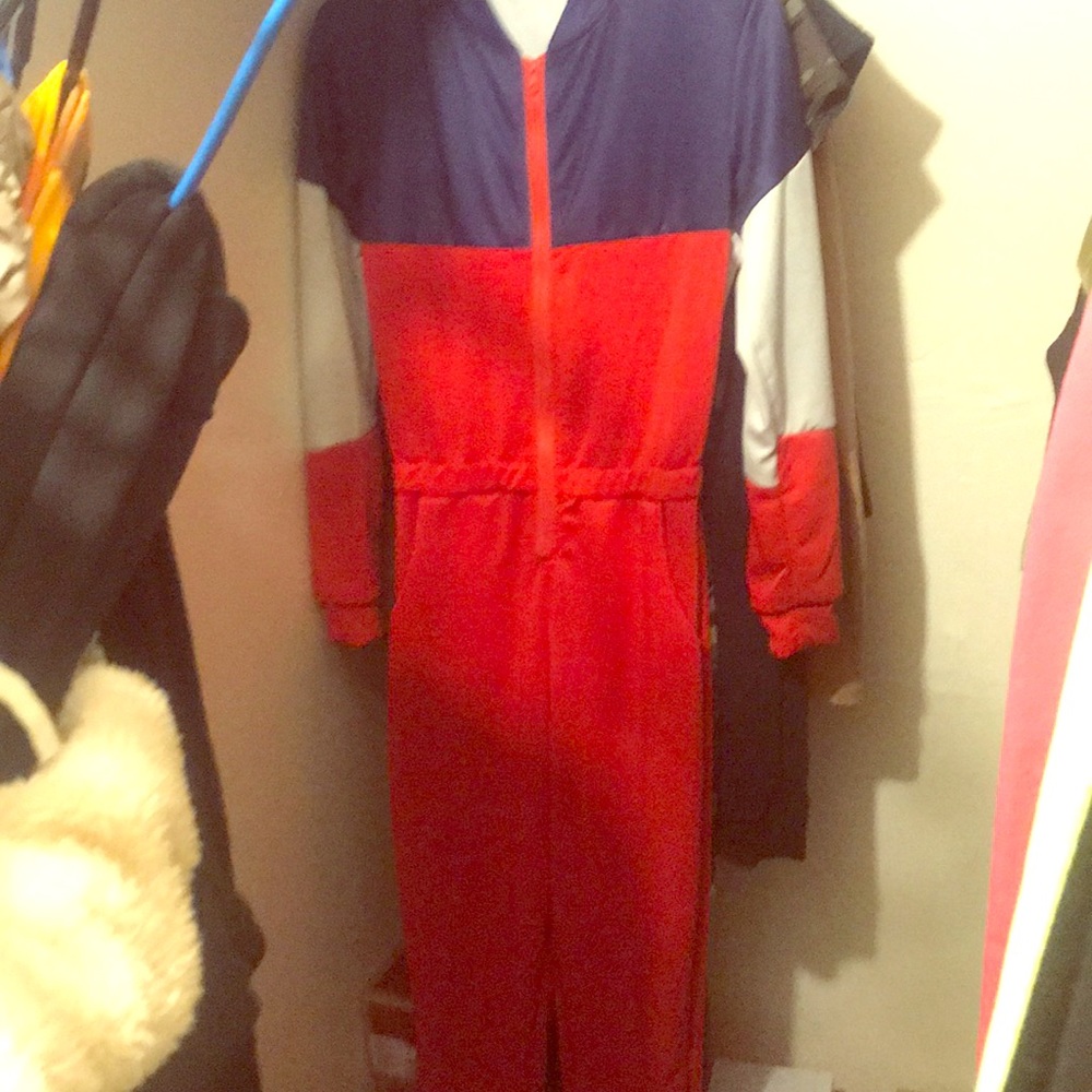 red , white , & blue jumpsuit .